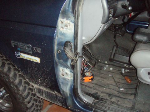 1995 Ford F-150 - Close-up of a 1995 Ford F-150 door jamb and interior, showing some rust and a Billabong sticker.
