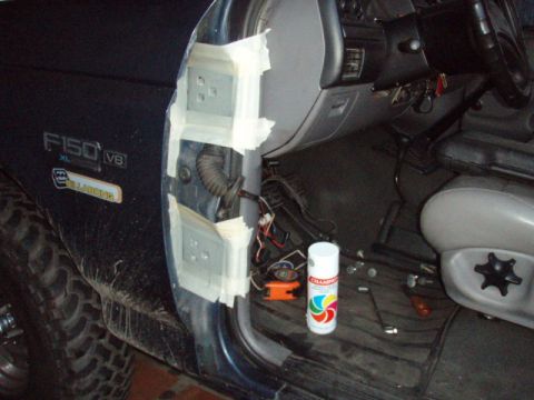 1995 Ford F-150 - The interior of a Ford F-150 shows the door jamb with wiring and a can of spray paint on the floor.