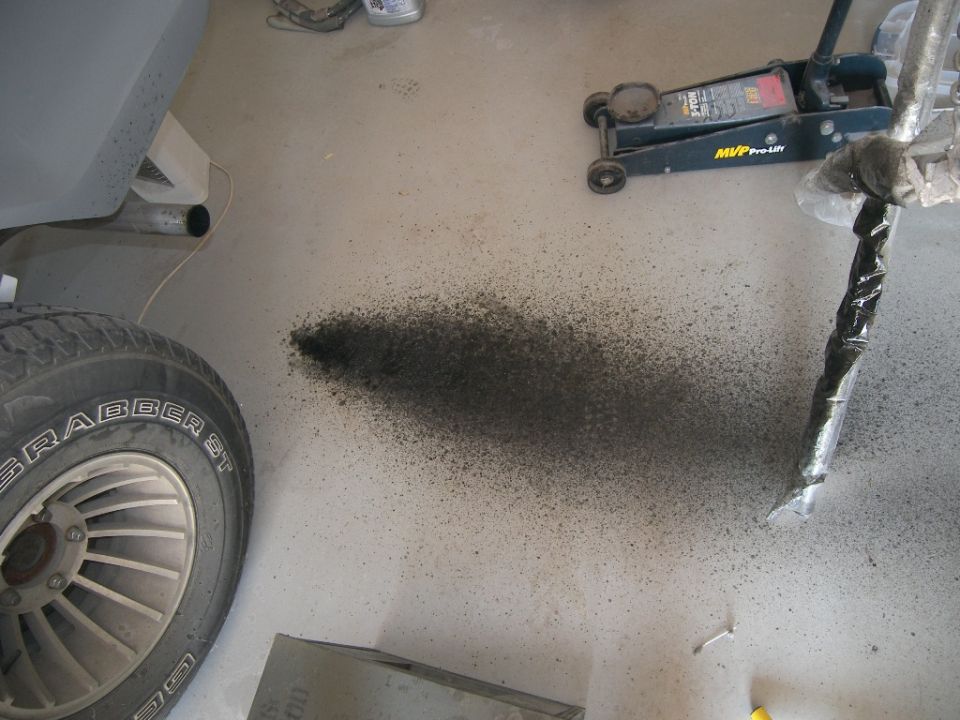 Carbon coming out of tailpipe.