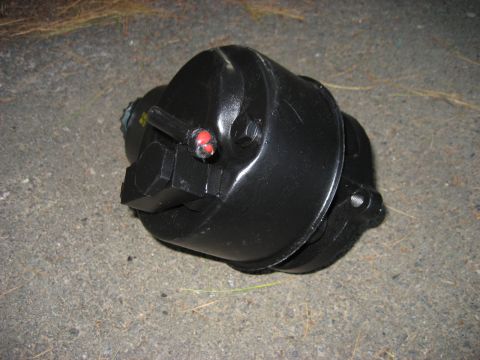 1991 Ford Bronco - Close-up of a black steering pump part, possibly for a Ford vehicle.