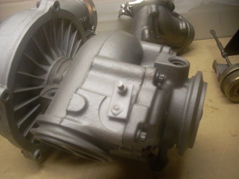 1991 Ford Mustang - Two turbocharger components are shown in detail, with a Supermotors.net watermark in the lower right corner.