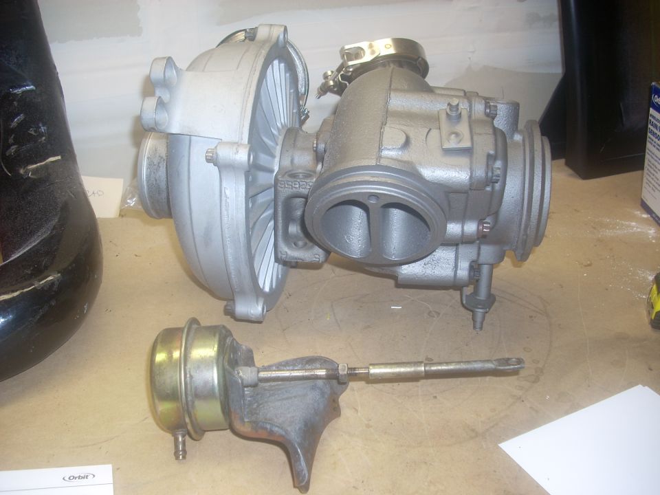 Turbocharger and wastegate assembly on a workbench