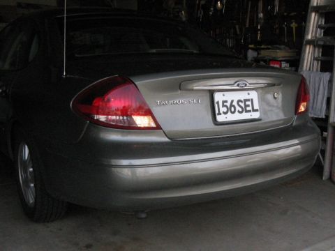 2003 Ford Taurus - Side view with lights on.