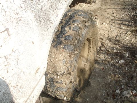 1989 Ford Bronco - A close-up view of the rear quarter panel of a 1989 Ford Bronco, showing its weathered condition.