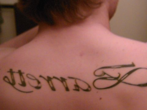 1987 Ford Bronco - A tattoo of the name 'Morris' and a symbol is visible on the back of a person.