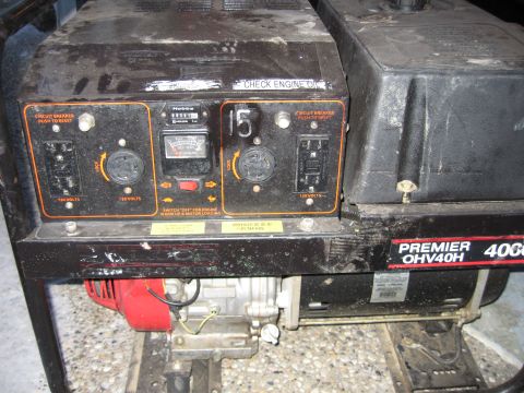 1996 Dodge 2500 - A generator with a control panel displaying various electrical outputs and a Hobbs meter is shown.