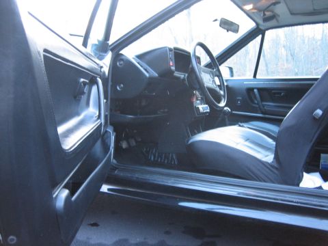 1987 Volkswagen Scirocco - The interior of a 1987 Volkswagen Scirocco is visible, the dashboard, steering wheel, and seats.