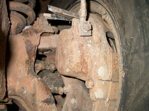 1990 Ford Bronco - Front brake caliper pin working it's way out the back. Scary!