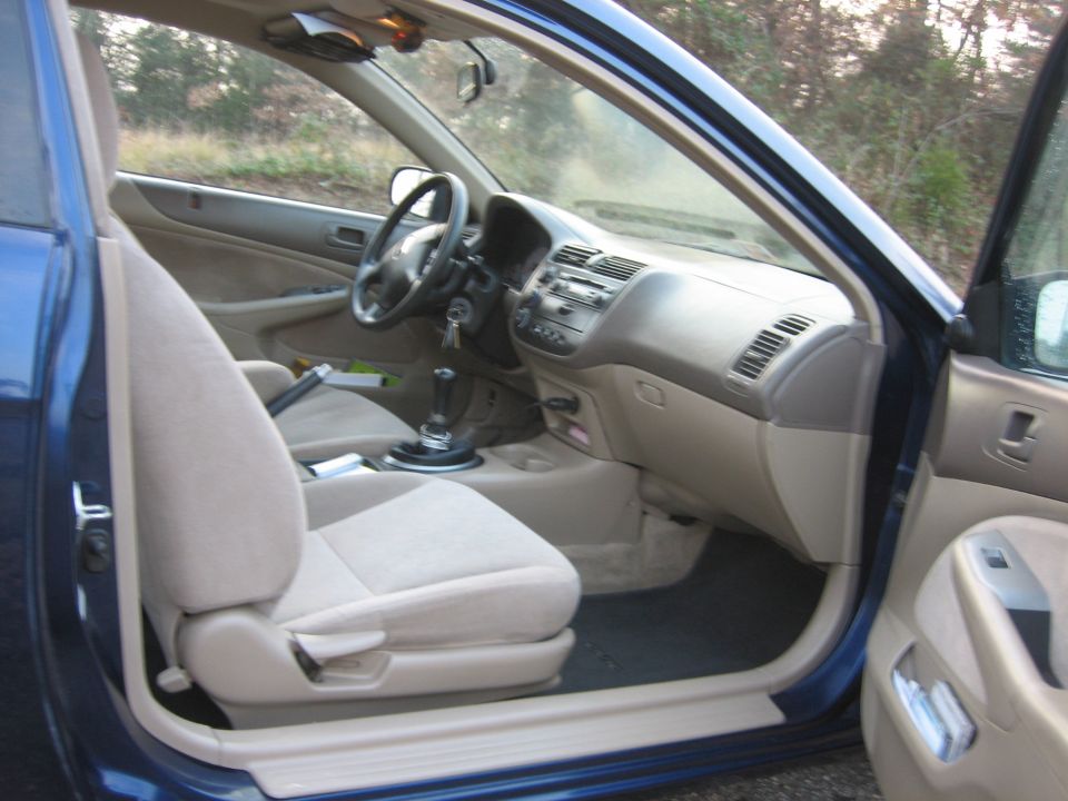 Interior view of a blue 2001 Honda Civic showing the dashboard and seats