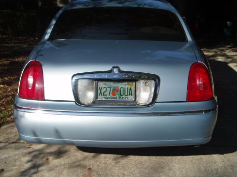 1998 Lincoln Town Car - Rear view of a 1998 Lincoln Town Car, displaying its taillights and Florida license plate.