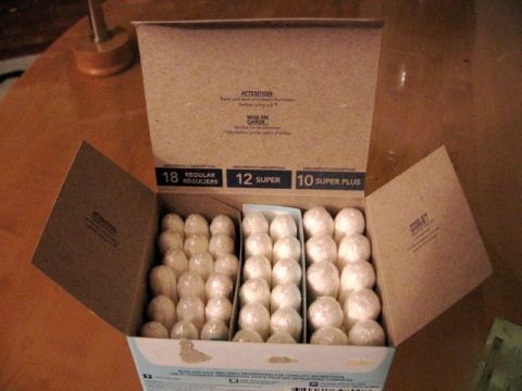 1989 Ford Bronco - A box is open, revealing rows of individually wrapped tampons in different absorbency levels.