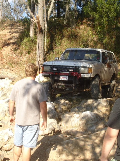 1989 Ford Bronco - This modified SUV is attempting to traverse a rocky trail.
