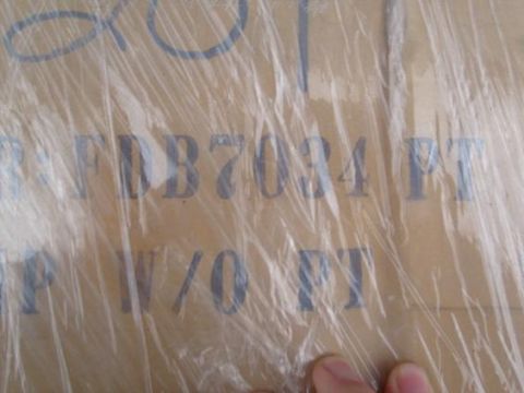 1995 Ford C-150 (Centurion Conversions) - A cardboard box with shipping information printed on it, including the text FDB7034 PT and W/O FT.