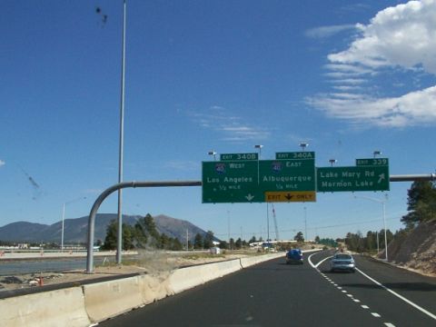 1995 Ford C-350 (Centurion Conversions) - Driving on a highway with multiple directional signs indicating different routes and destinations.
