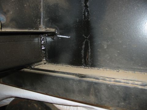 1993 Ford Taurus - Close-up view of a welded metal frame, showing signs of wear and dust accumulation.