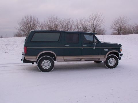 1995 Ford C-350 (Centurion Conversions) - This 1995 Ford C-350 Centurion Conversions SUV is seen from the side, parked in a snowy landscape.