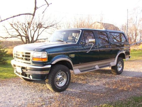 1995 Ford C-350 (Centurion Conversions) - This 1995 Ford Bronco conversion is shown from the front three-quarter view on a gravel surface.