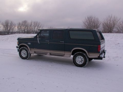 1995 Ford C-350 (Centurion Conversions) - This 1995 Ford C-350 (Centurion Conversions) is shown in a three-quarter front view, parked in a snowy landscape.
