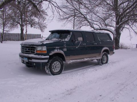 1995 Ford C-350 (Centurion Conversions) - This 1995 Ford C-350 Centurion Conversions SUV is seen parked in a snowy landscape.