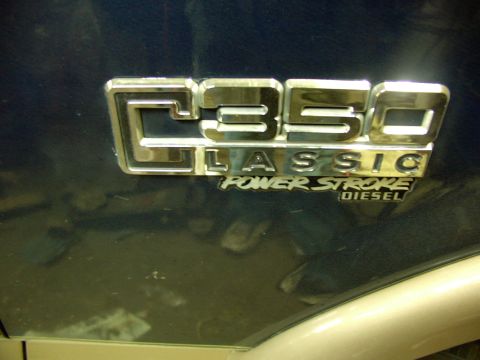 1995 Ford C-350 (Centurion Conversions) - Close-up of a C350 Classic Power Stroke Diesel badge.