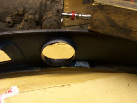 1995 Ford C-350 (Centurion Conversions) - This image shows a part of a vehicle's front bumper with two openings.