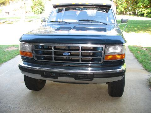 1995 Ford C-350 (Centurion Conversions) - The front of a 1995 Ford C-350 (Centurion Conversions) truck, its distinctive grille and bumper.