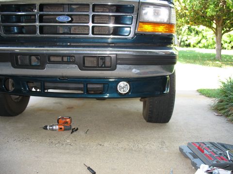 1995 Ford C-350 (Centurion Conversions) - Front view of a 1995 Ford C-350 (Centurion Conversions) showing the bumper and a newly installed fog light.