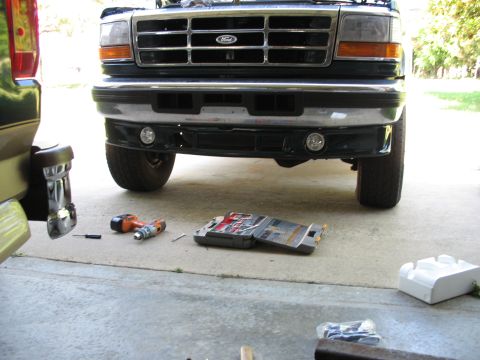 1995 Ford C-350 (Centurion Conversions) - Frontal view of a 1995 Ford C-350 (Centurion Conversions) truck, with tools laid out on the concrete.