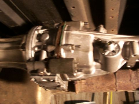 1995 Ford C-350 (Centurion Conversions) - Underside view of a vehicle transmission component, possibly part of a Gear Vendor overdrive unit.