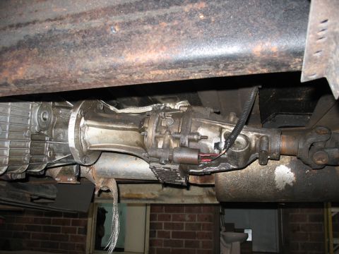 1995 Ford C-350 (Centurion Conversions) - Underside view of a vehicle's transmission and driveshaft components.