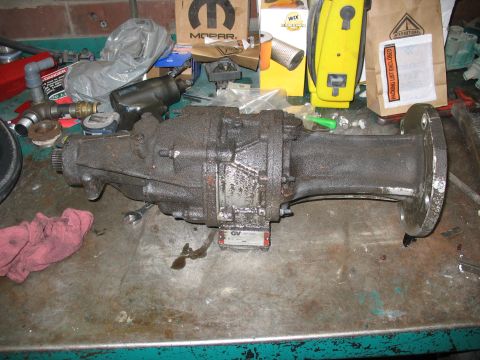 1995 Ford C-350 (Centurion Conversions) - A Gear Vendor overdrive unit is shown on a workbench, with various tools and parts in the background.