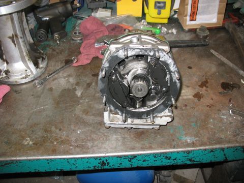 1995 Ford C-350 (Centurion Conversions) - Workbench scene with a disassembled transmission part and various tools, including an impact wrench.