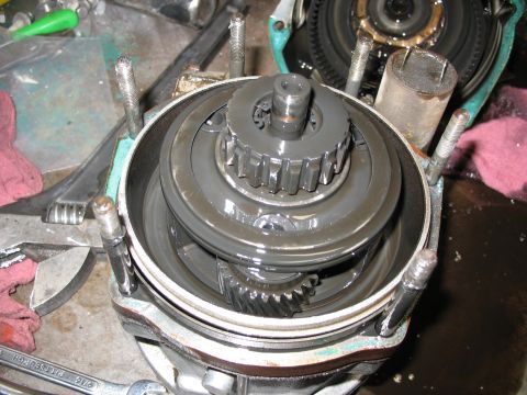 1995 Ford C-350 (Centurion Conversions) - Internal gears and components of a transmission or overdrive unit are visible in this close-up.