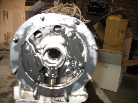 1995 Ford C-350 (Centurion Conversions) - Disassembled automotive part, likely from a transmission or differential, covered in grease.