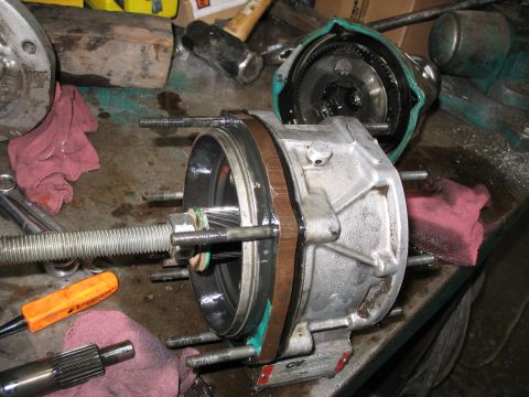 1995 Ford C-350 (Centurion Conversions) - A disassembled Gear vender part is shown on a workbench with tools and rags.