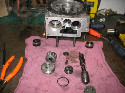 1995 Ford C-350 (Centurion Conversions) - Disassembled vehicle part laid out on a pink cloth with tools nearby.