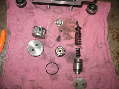 1995 Ford C-350 (Centurion Conversions) - Various transmission components are disassembled and laid out on a pink cloth for inspection or repair.