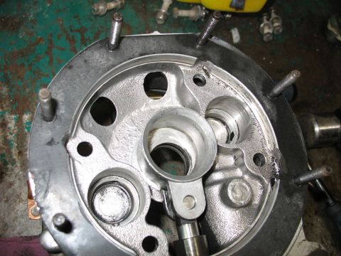 1995 Ford C-350 (Centurion Conversions) - Disassembled engine cylinder head showing internal components and bolt holes.