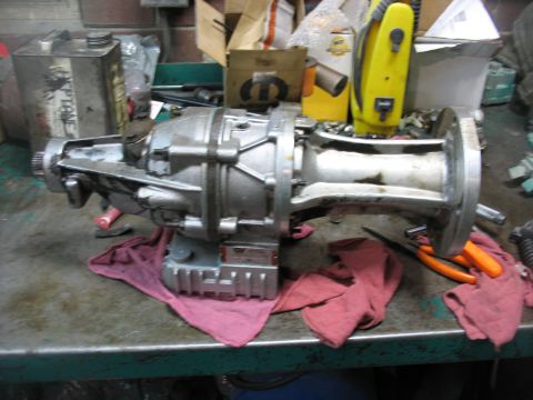 1995 Ford C-350 (Centurion Conversions) - A silver gear vender overdrive unit is shown on a workbench, possibly for a 1995 Ford C-350 Centurion Conversions.