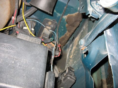 1995 Ford C-350 (Centurion Conversions) - Detail of automotive wiring and fuse box, showing electrical connections and components.