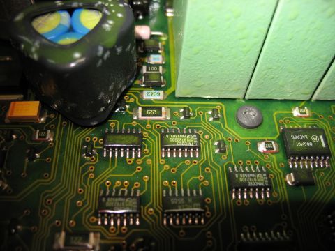 1995 Ford C-350 (Centurion Conversions) - Close-up view of a green circuit board various electronic components including capacitors and chips.