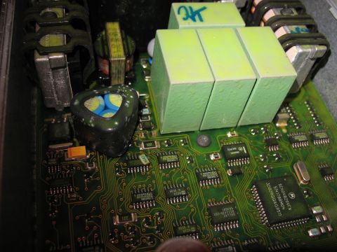 1995 Ford C-350 (Centurion Conversions) - This is a close-up view of an electronic control unit's circuit board, showing integrated circuits and other electronic components.