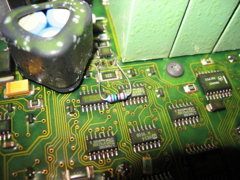 1995 Ford C-350 (Centurion Conversions) - Close-up of a green circuit board with various electronic components including integrated circuits, a resistor, and a large capacitor.