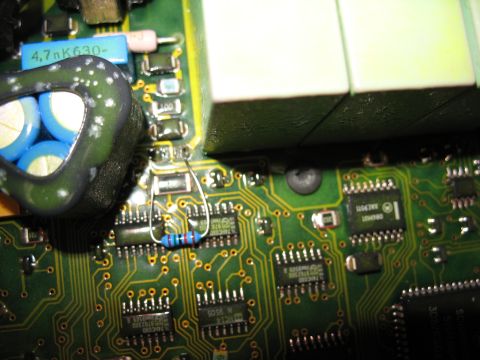 1995 Ford C-350 (Centurion Conversions) - Close-up view of a green circuit board with various electronic components, including a resistor and capacitors.