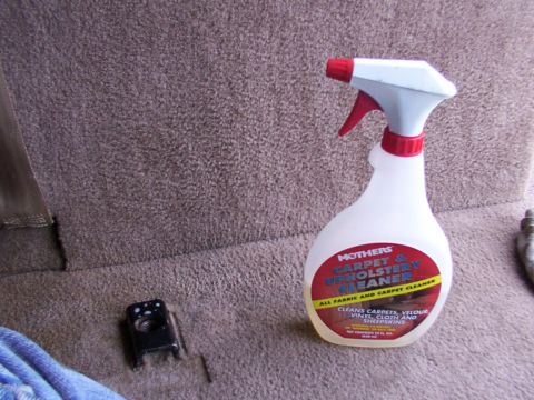 1995 Ford C-350 (Centurion Conversions) - A bottle of Mothers Carpet & Upholstery Cleaner sits on the carpeted interior of a vehicle.
