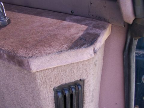 1995 Ford C-350 (Centurion Conversions) - Interior view of a vehicle's dashboard trim and a vent grille.