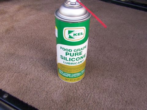 1995 Ford C-350 (Centurion Conversions) - A can of KEL food grade pure silicone lubricant sits on a carpeted surface.
