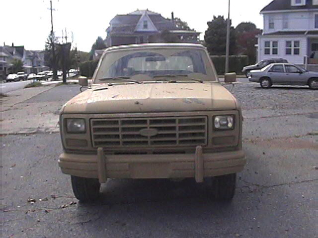 Tan SUV front view, 1980s body style