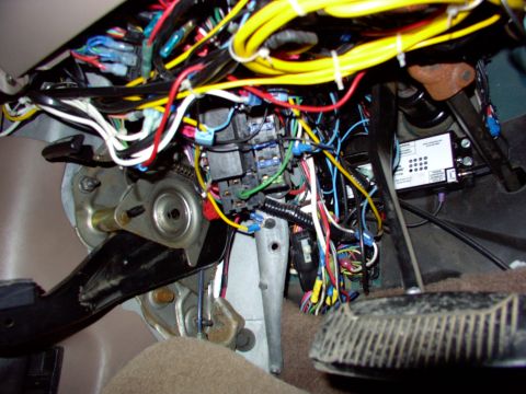 1995 Ford C-350 (Centurion Conversions) - A dense network of wires and electrical components is visible within the vehicle's interior.