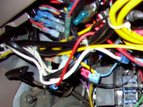 1995 Ford C-350 (Centurion Conversions) - A tangle of wires and electrical components, likely part of a vehicle's interior wiring system.
